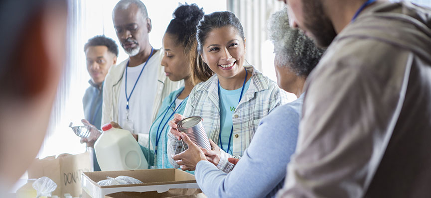 Diverse group of people volunteering at a food bank